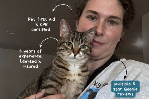 Pet owner holding a cat with pet first aid and review icons.